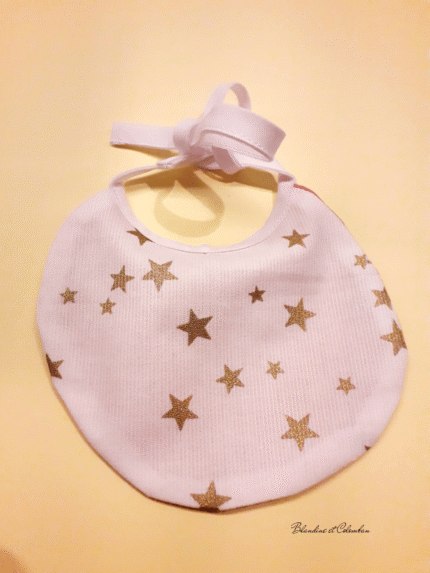 Bavoir poupée étoiles dorées