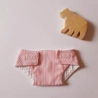 Couche poupon rayée rose et blanc